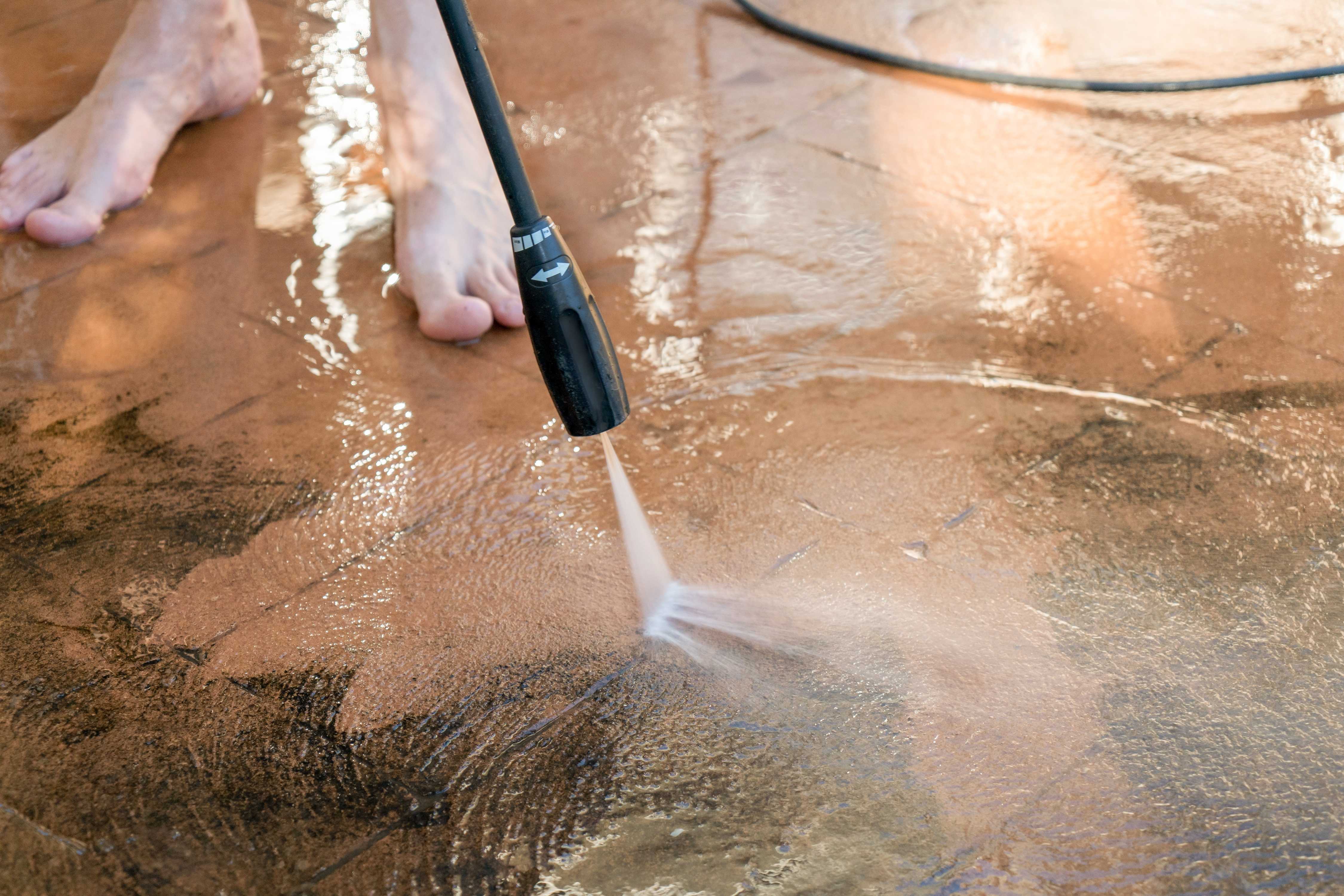 washing house with pressure washer